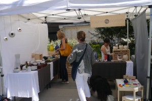 Sophia Pottery Booth with shoppers in action